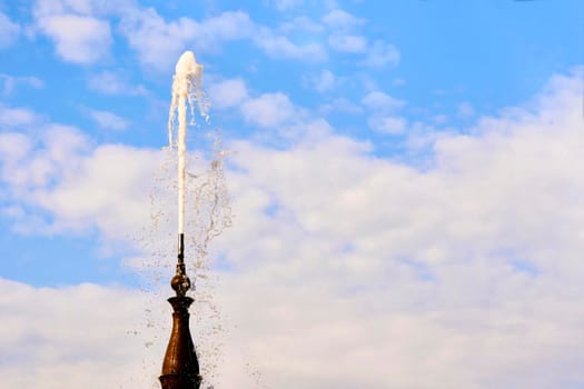 an ornamental structure in a pool or lake from which one or more jets of water are pumped into the air.