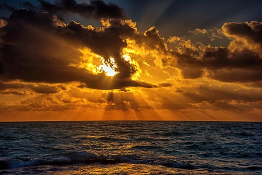 Sunset on the Caribbean Sea. Clear sky with small clouds. Clear weather.