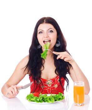 Woman with plate of salad and orange juice, isolated on white.