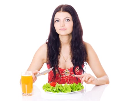 Woman with plate of salad and orange juice, isolated on white.