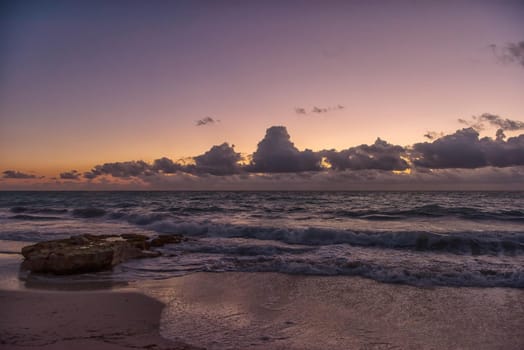 Sunset on the Caribbean Sea. Clear sky with small clouds. Clear weather.