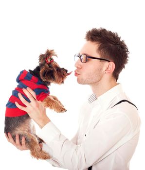 Man holding his pet Yorkshire Terrier in front of his face. Isolated on white.