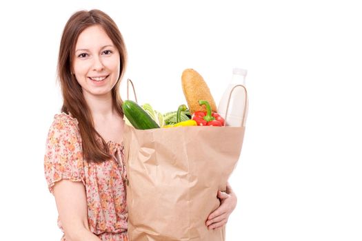 Happy Young Woman Holding Large Bag of Healthly Groceries. Isolated on white