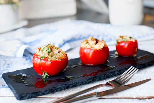 Tomato stuffed with cous cous. Vegetarian healthy food