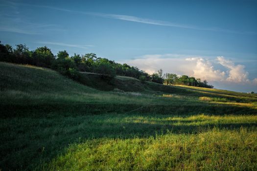 Landscape of green valley and blue sky. Ukraine.