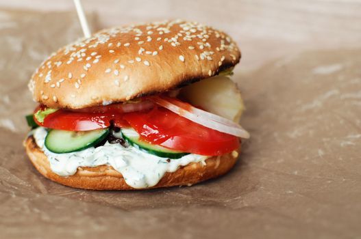 Homemade hamburger or cheeseburger with fresh vegetables