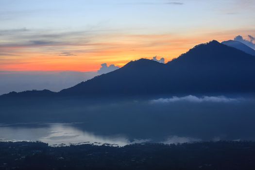 Active volcano. Beautiful sunrise from the top of Mount Batur - Bali, Indonesia