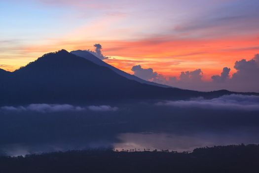 Active volcano. Beautiful sunrise from the top of Mount Batur - Bali, Indonesia
