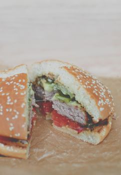 Homemade hamburger or cheeseburger with fresh vegetables