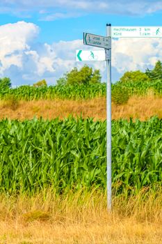 North German agricultural field forest walking trekking path with sign for bicycle and nature landscape panorama in Hemmoor Hechthausen Cuxhaven Lower Saxony Germany.