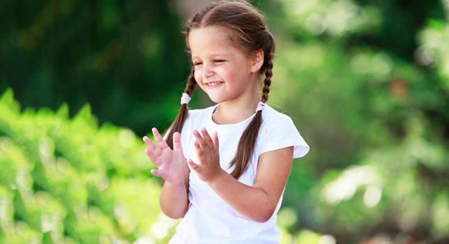 Cute little girl playing in the sun. Freedom concept.