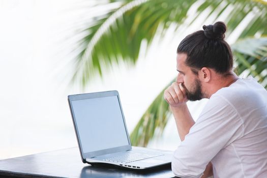 telecommuting, businessman relaxing on the beach with laptop and palm, freelancer workplace, dream job