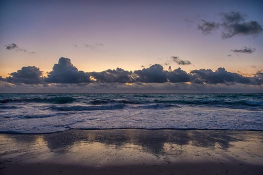 Sunset on the Caribbean Sea. Clear sky with small clouds. Clear weather.