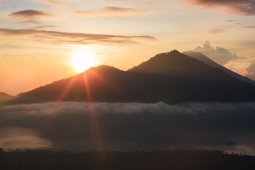 Active volcano. Beautiful sunrise from the top of Mount Batur - Bali, Indonesia