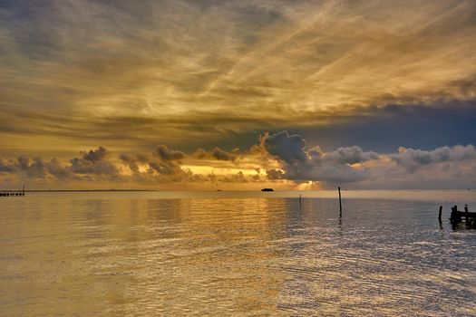 Sunset on the Caribbean Sea. City of Cancun, Mexico. Beautiful clouds and the sea.