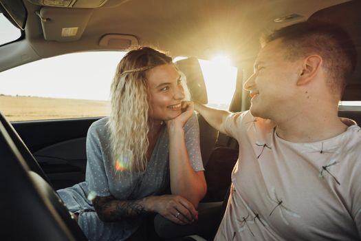 Happy Couple Enjoying Road Trip, Young Woman and Man Having Fun Time While Traveling by Car