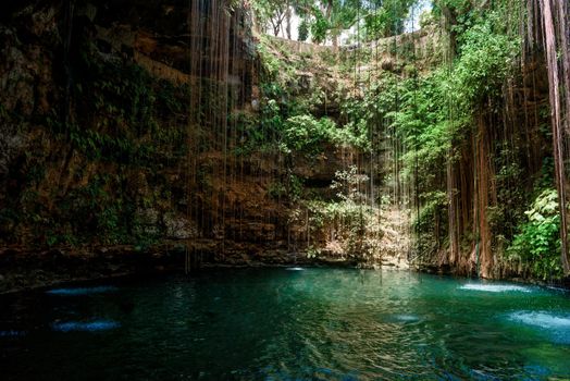 Cenote Ecoturistico Ik-Kil with blue clear water. Inside view.