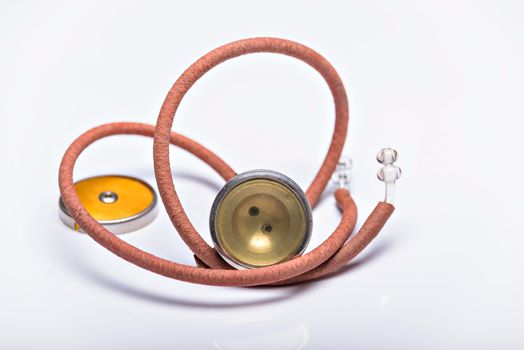 Medical Instrument vintage antique stethoscope isolated on white background