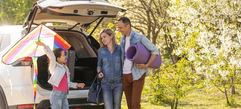 happy family enjoying road trip and summer vacation