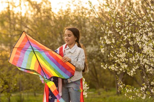 little girl with kite and usa flag.