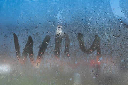 Inscription word why on a foggy window