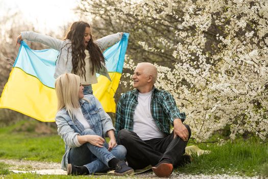 family wreaths blue and yellow flag of Ukraine. Family, unity, support. Ukrainians are against war. Woman and child. Freedom to Ukraine. Stop Russian aggression
