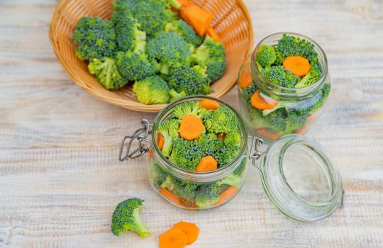 Preservation of broccoli with carrots in jars. Selective focus. nature.
