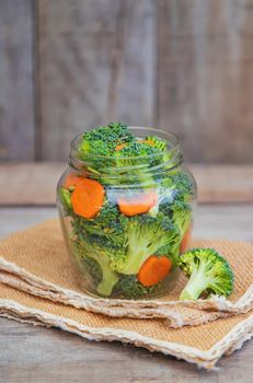 Preservation of broccoli with carrots in jars. Selective focus. nature.