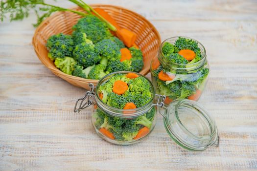 Preservation of broccoli with carrots in jars. Selective focus. nature.
