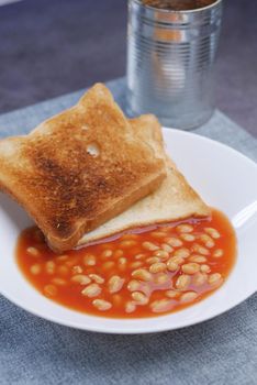 pouring beans from a tin container