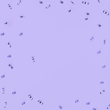 Spurs on a trendy pastel purple background. Festive background with confetti. fashion concept.