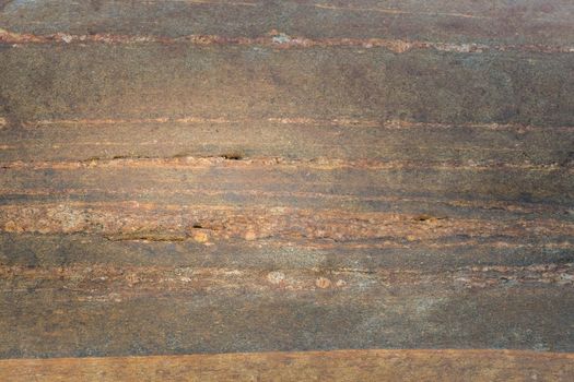 Close-up texture of a natural river bank stone wall in a mountain forest in northern Thailand. Stone and ecology concept.