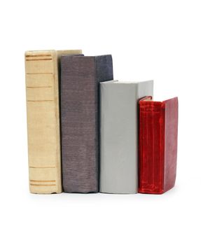 Few old books in a row isolated on white background with clipping path