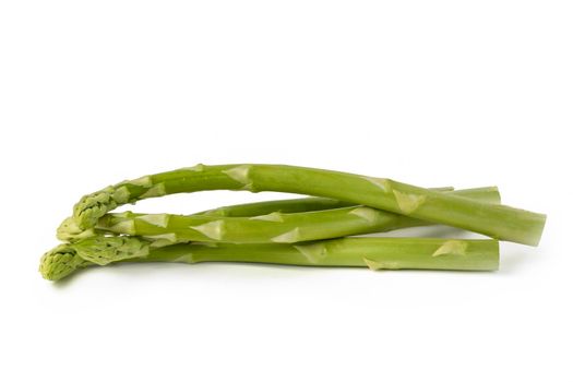 Bunch of fresh green asparagus isolated on white background. Freshly picked asparagus with water drops isolated on white background