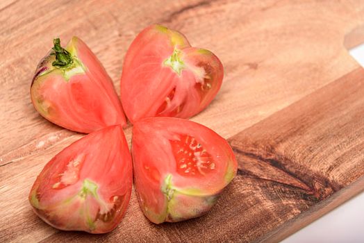 Fresh tomatoes in a plate on a dark background. Harvesting tomatoes. Top view