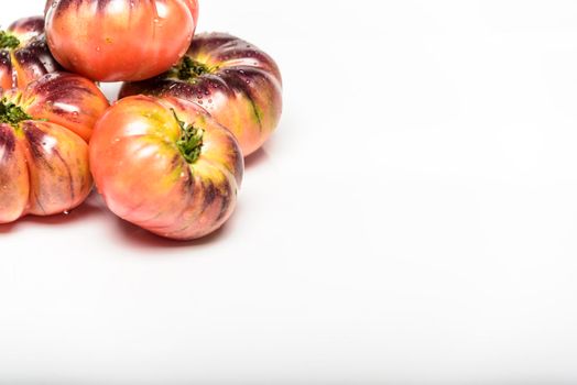 Green Tiger tomatoes isolated on white, top view