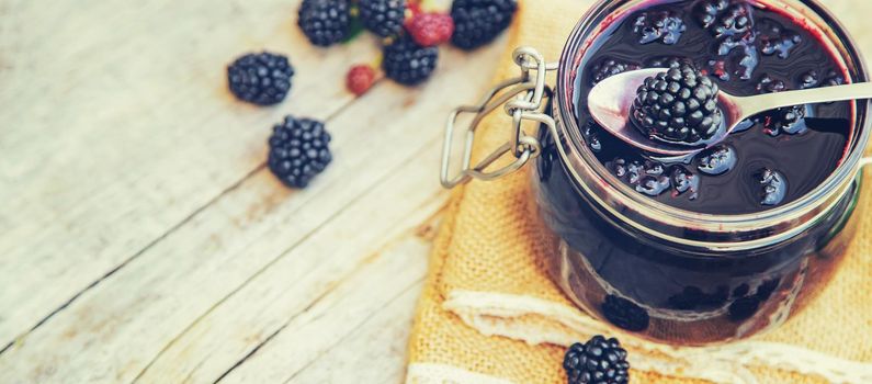 Blackberry jam in a jar. Selective focus. nature