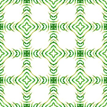 Textile ready alive print, swimwear fabric, wallpaper, wrapping. Green amusing boho chic summer design. Ikat repeating swimwear design. Watercolor ikat repeating tile border.