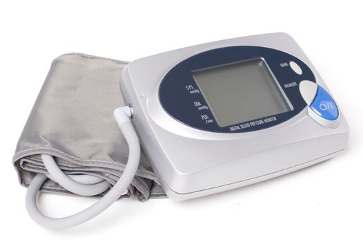 Digital blood pressure monitor on white background - Stock Image