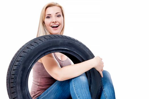 Woman with car wheels, isolated on white.