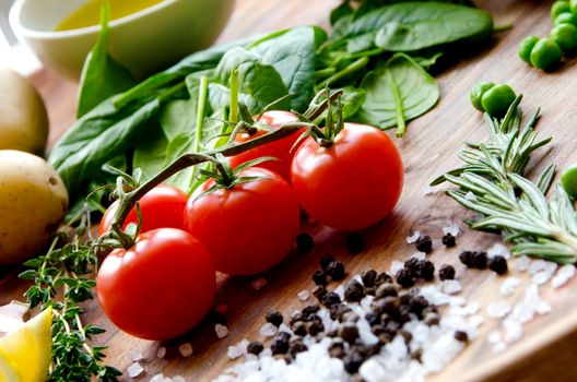 Fresh vegetables and ingredients for cooking tuna salad on the wooden. Dark colors.