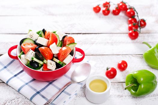 Greek salad in red boul and copy space - Stock image