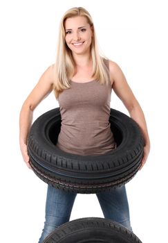 Young sexy girl with car wheels, isolated on white.