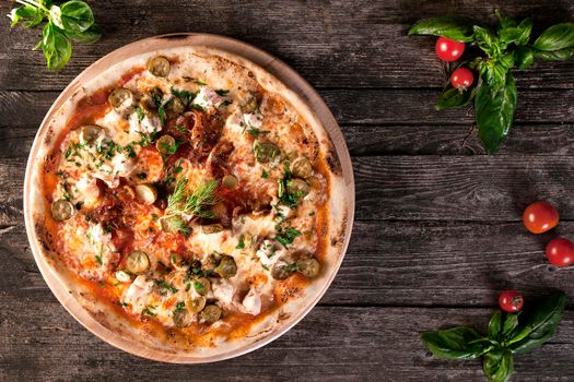 Pepperoni Pizza with bacon, meat , beef, cheese ,pickles , cucumbers and green onions on the wooden background. Top view. on the wooden background. Top view.