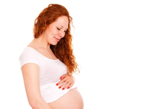 Pregnant woman hugging her belly and smiling. Isolated