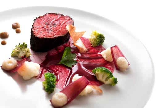 Delicious modern veal fillet served with sauce. Molecular cuisine with steak.