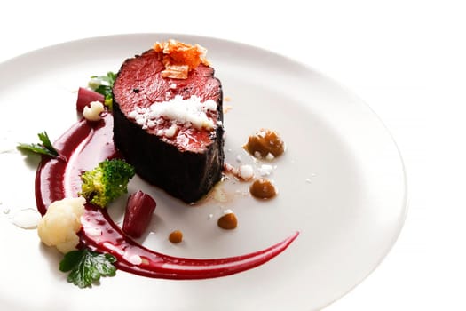 Delicious modern veal fillet served with sauce. Molecular cuisine with steak.