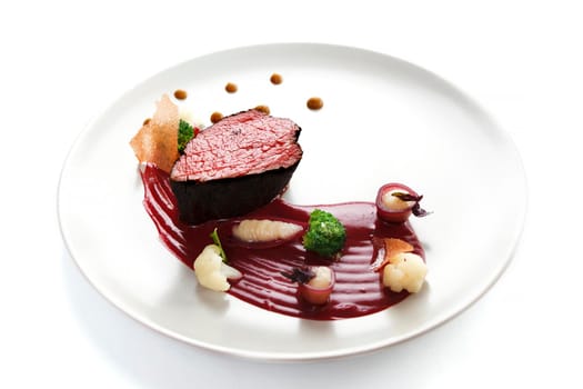 Delicious modern veal fillet served with sauce. Molecular cuisine with steak.