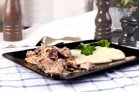 Beef Stroganoff with mashed potatoes or celery in a restaurant - Stock image