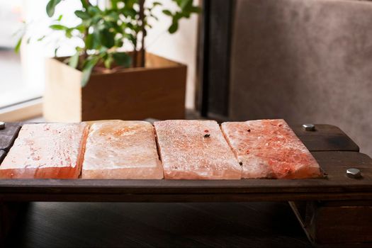 Himalayan pink salt. Salt plates. Bars of salt for cooking.